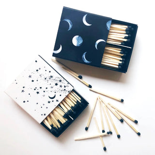 Stars matches with black match tips next to the moon matches.