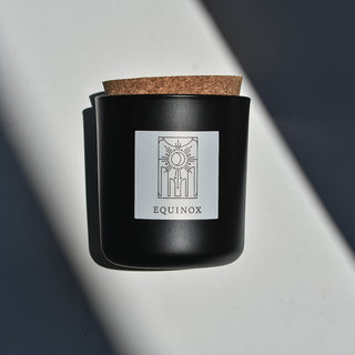 Equinox black glass candle with cork top.