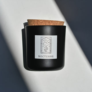 Nocturne candle in black apothecary glass with cork top.