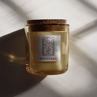 Nocturne candle in yellow pollen glass with cork top.