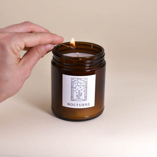 Luxury coconut wax scented candle in amber jar and art deco styled label