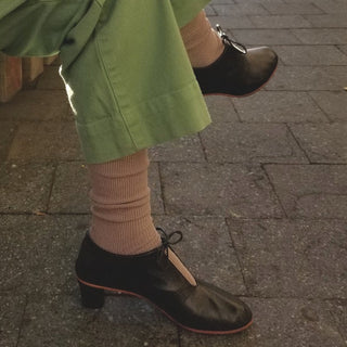 le bon shoppe trouser socks pictured with green trousers and black heeled ankle boots 